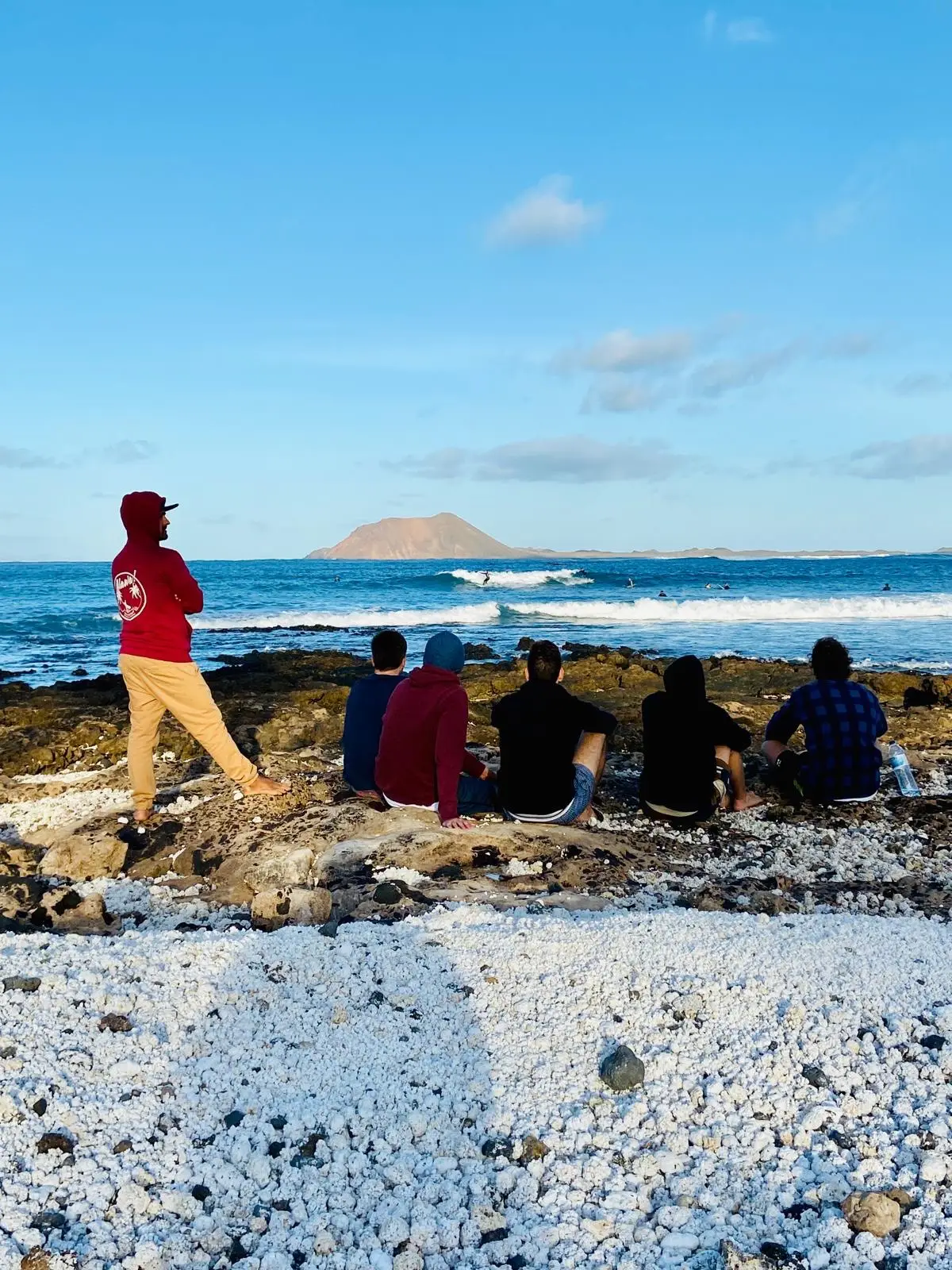Surf course group watching waves and surf conditions in Fuerteventura